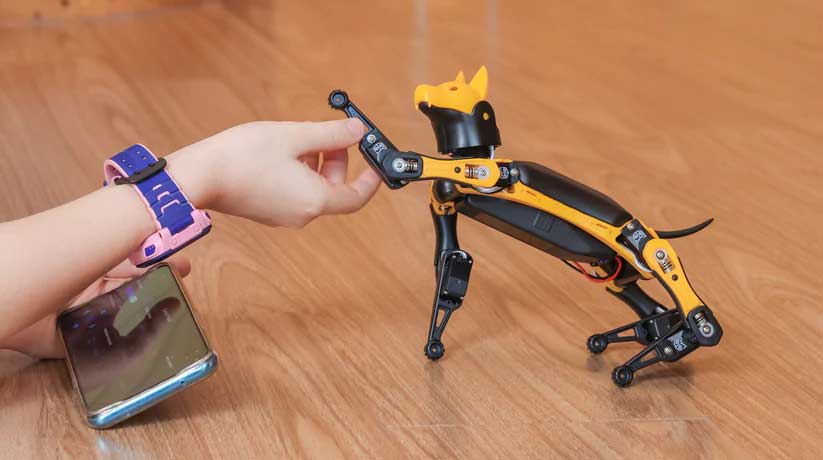 Petoi robot dog Bittle shakes hand